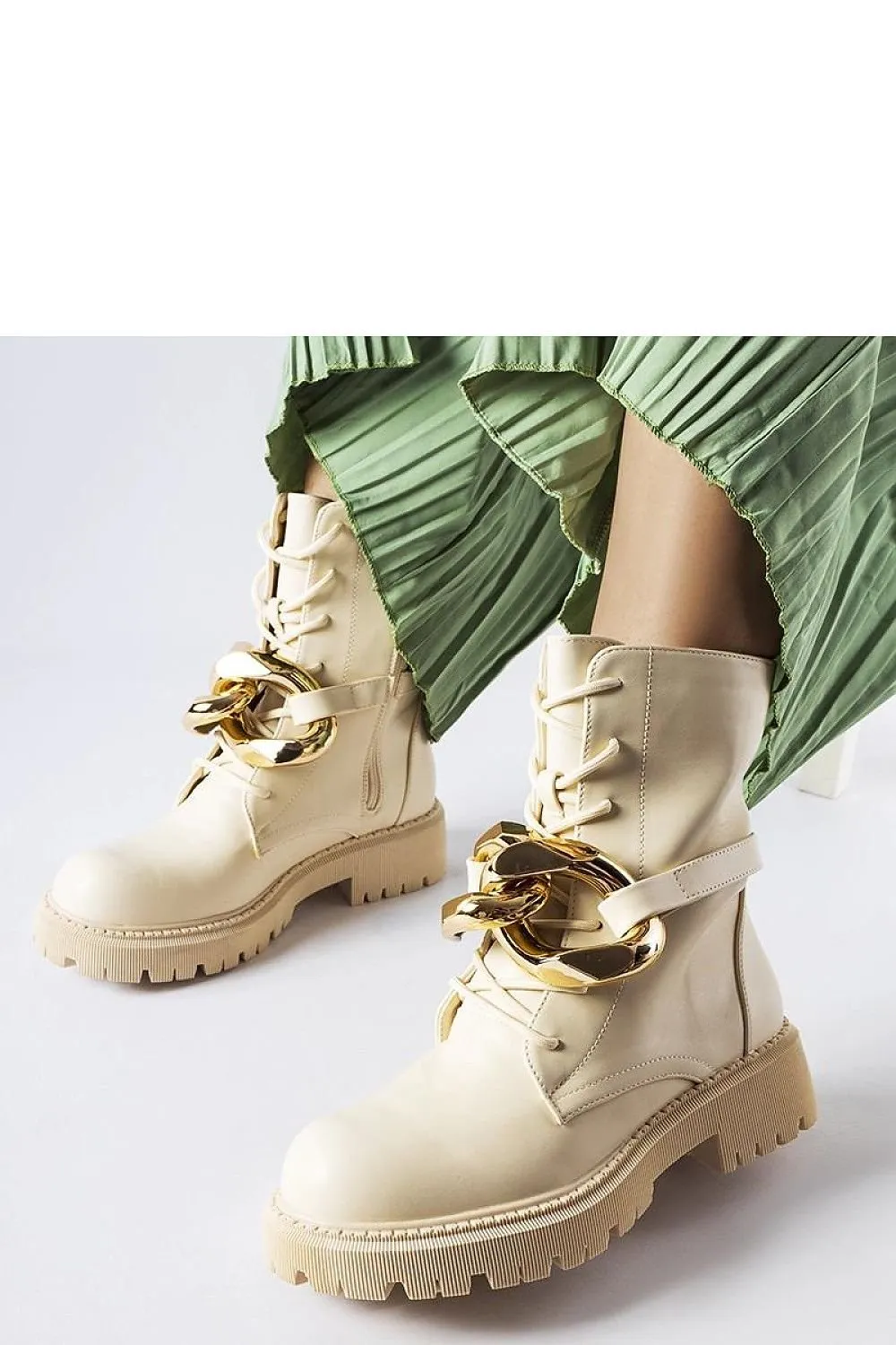 Beige boots with a chain