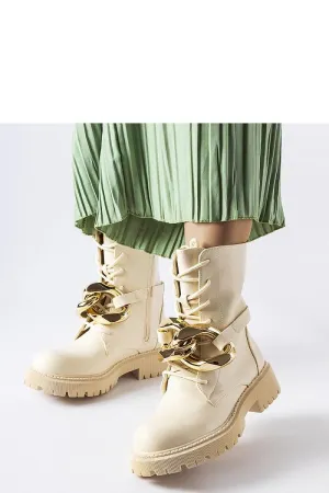 Beige boots with a chain