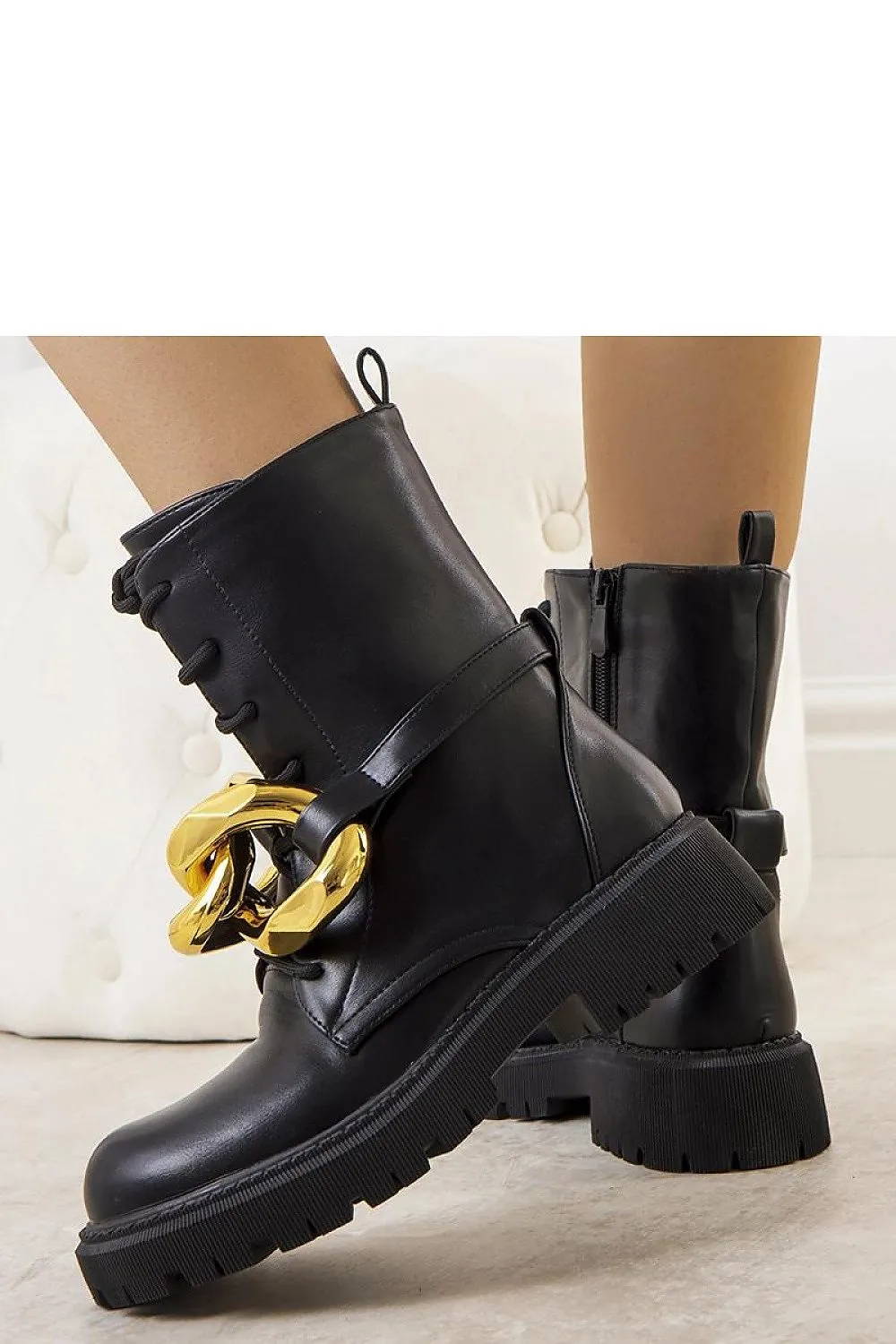 Beige boots with a chain